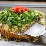 Traditional Japanese okonomiyaki, savory pancake