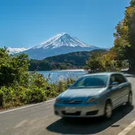 Drive a rental car with view on mount Fuji