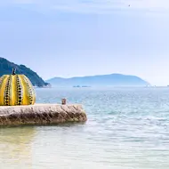 Yayoi Kusama's yellow pumpkin, the symbol of Naoshima, a must-visit art island in the Seto Inland Sea.