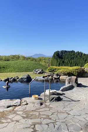 Outdoor swimming pool with a view of Mount Aso