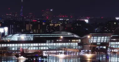 Fukuoka Airport International Terminal at night with Fukuoka City in the background