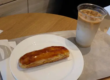 Eclaire and coffee at Sky Room Cafe and Bar Eclaire and coffee at Sky Room Cafe and Bar