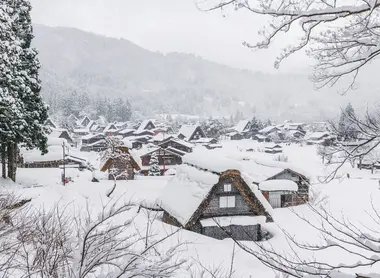 Shirakawago village in Winter with snow surrounding the homes and farmhouses