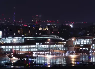 Fukuoka Airport International Terminal at night with Fukuoka City in the background