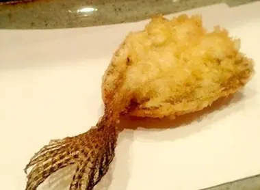 Each is delicately tempura filed on paper, freeing the last oil envelopes that surround it.