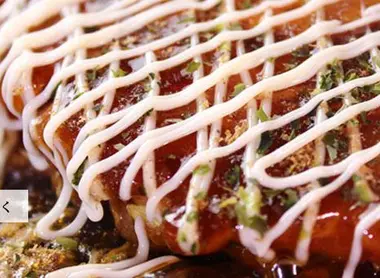 The okonomiyaki, you make your own at Sakura Tei's Harajuku, Japanese pancakes are made with eggs and cabbage