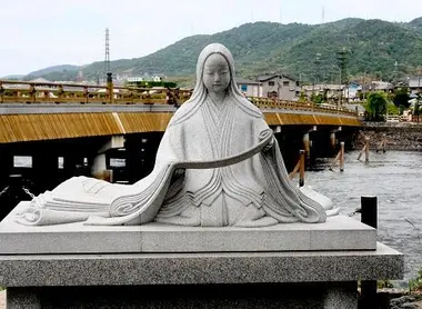 A statue of a character from the Genji Monogatari, before the bridge Kingdom.