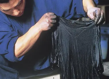A dry cleaner worker open book