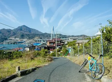 A small fishing village and a view of Kurushima bridge along the Shimanami Kaido. A small fishing village and a view of Kurushima bridge along the Shimanami Kaido.