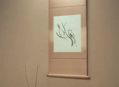This takemonois composed of a flower arrangement and calligraphy suggesting spring