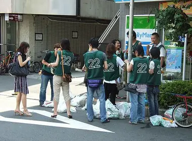 Japanese Volunteers collecting trash