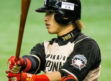 Le joueur Dai-Kang Yang de l'équipe Hokkaido Nippon Ham Fighters, gagnante de la ligue pacifique en 2016