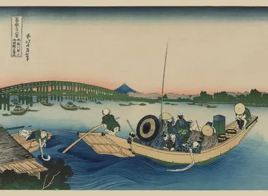 Coucher de soleil à travers le pont Ryōgoku sur la rivière Sumida à Onmayagashi.