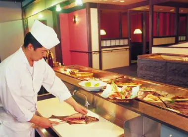 A chef preparing sashimi inn Shiretoko Grand Hotel, Hokkaido