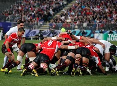 The Japanese scrum (in red) fights against the French team (in white)