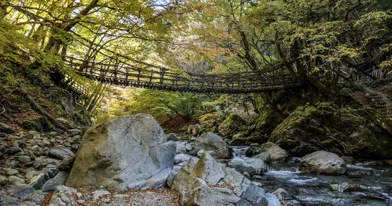 A rope bridge over a river in Iya Valley