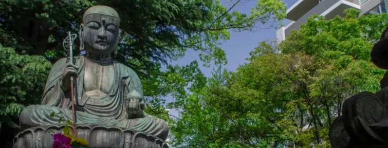 Jizo Statue surrounded by trees