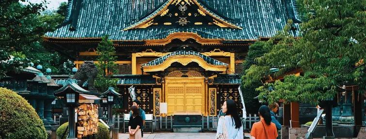 Black wooden shrine with gold doors