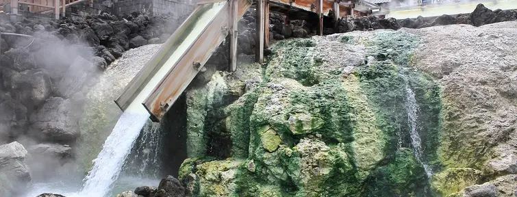Water pouring into a outdoor cooling pool in Kasatsu Onsen