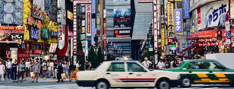 Busy road in Shinjuku with taxis