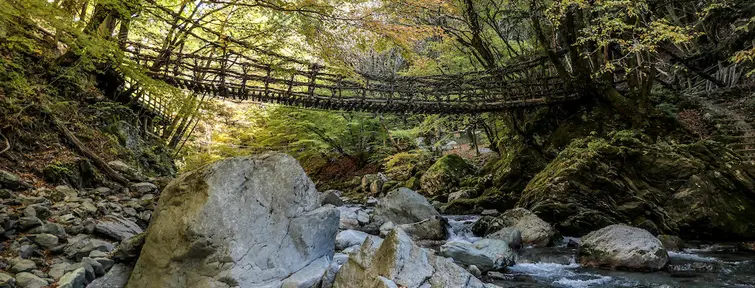 A rope bridge over a river in Iya Valley